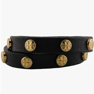 Tory Burch leather bracelet with gold colored hardware.
